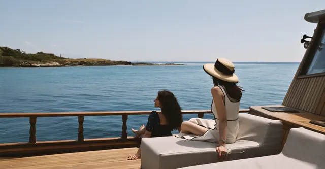 Guests relaxing on the shaded deck of AXION ESTI
