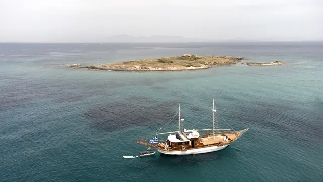 AXION ESTI anchored near a small island