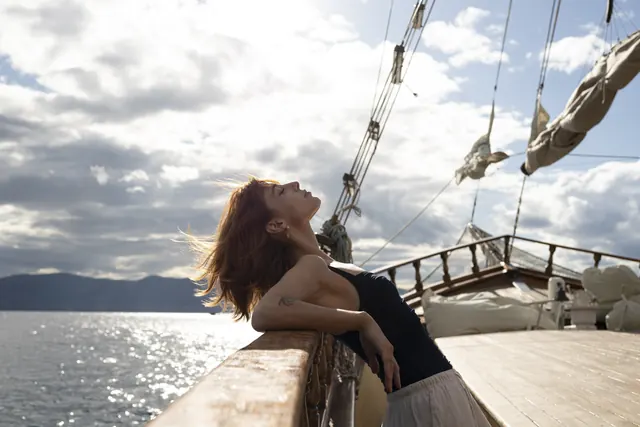 Guest enjoying the sea breeze on deck