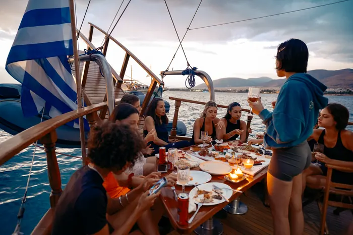 Guests aboard AXION ESTI during a private cruise from Athens